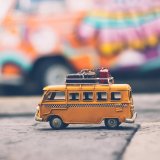 selective focus photography of yellow school bus die cast