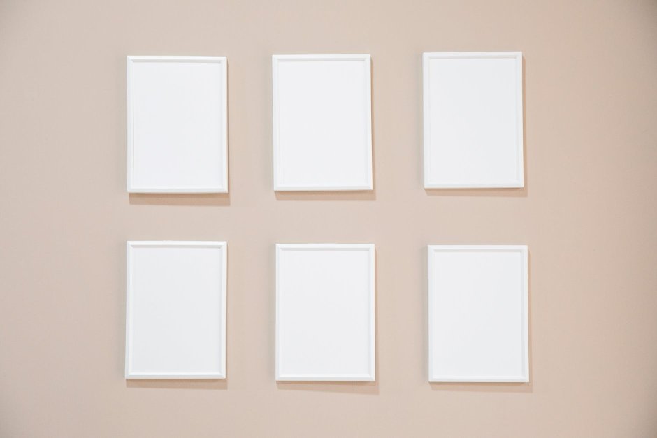 white empty frames hanging on wall